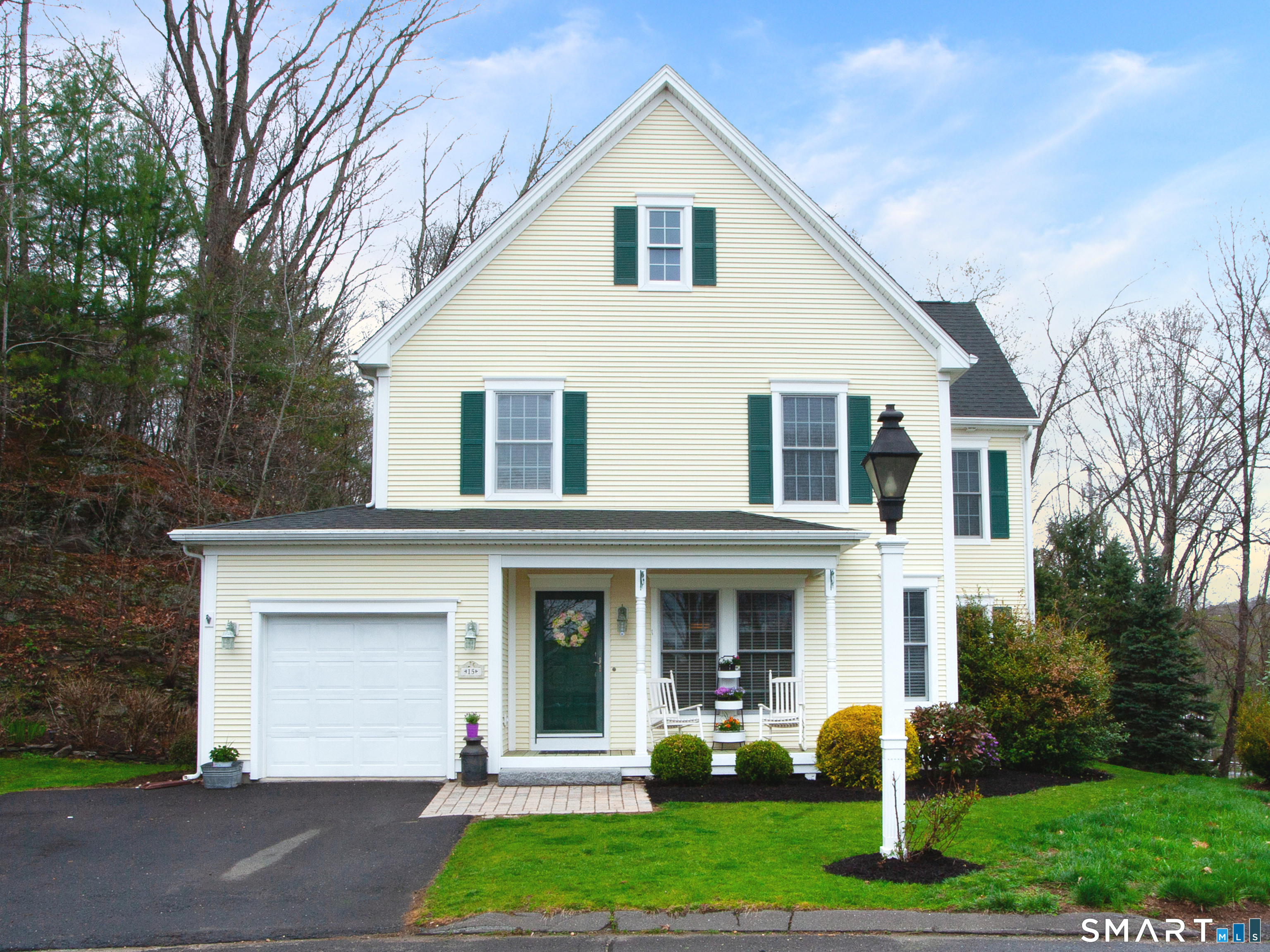 15 Rockledge Lane Canton, CT 06019 - Photo 30 of 30 a front view of a house with garden and trees