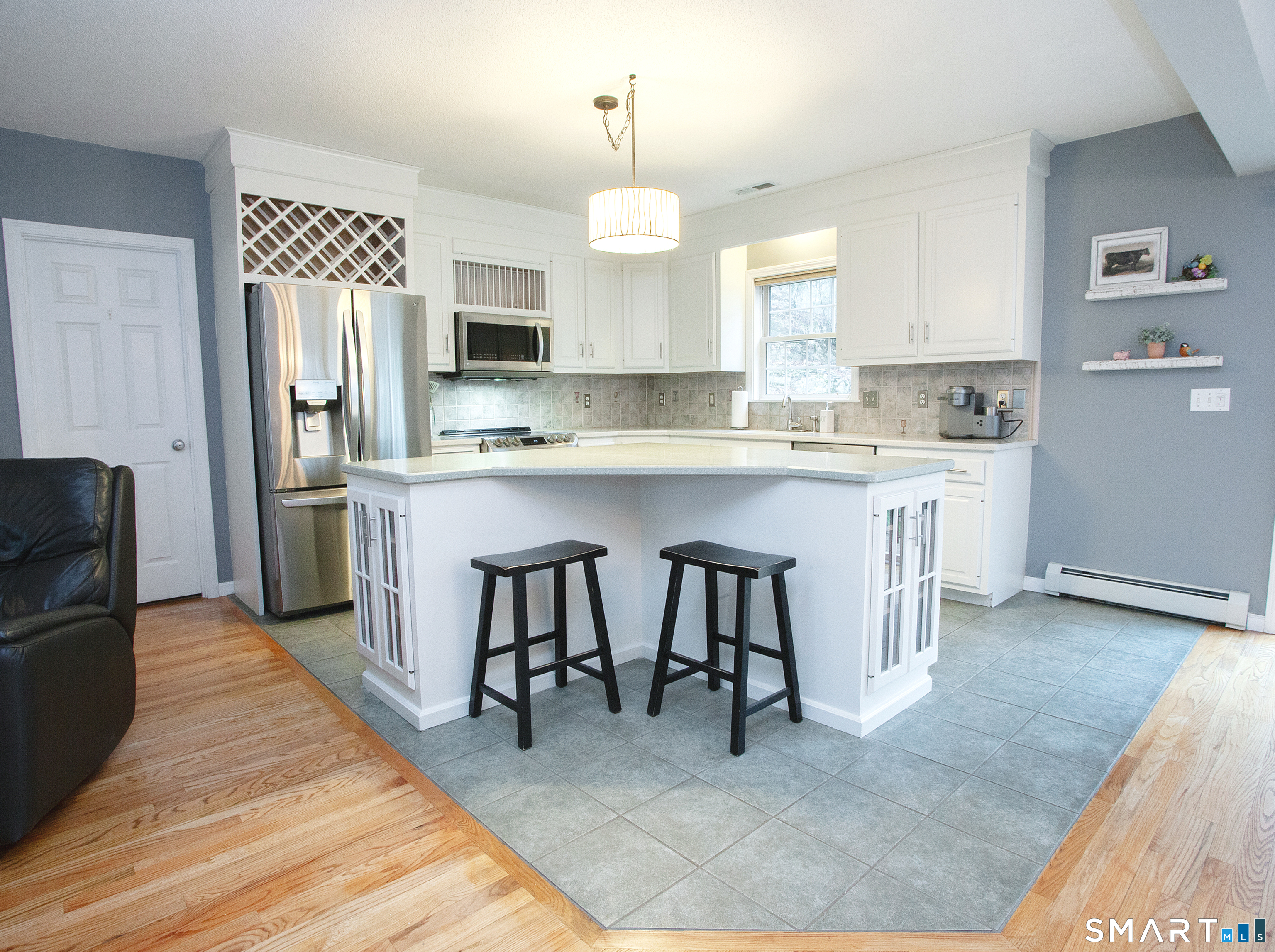 15 Rockledge Lane Canton, CT 06019 - Photo 5 of 30 a large kitchen with stainless steel appliances granite countertop a sink dishwasher a refrigerator and a fireplace