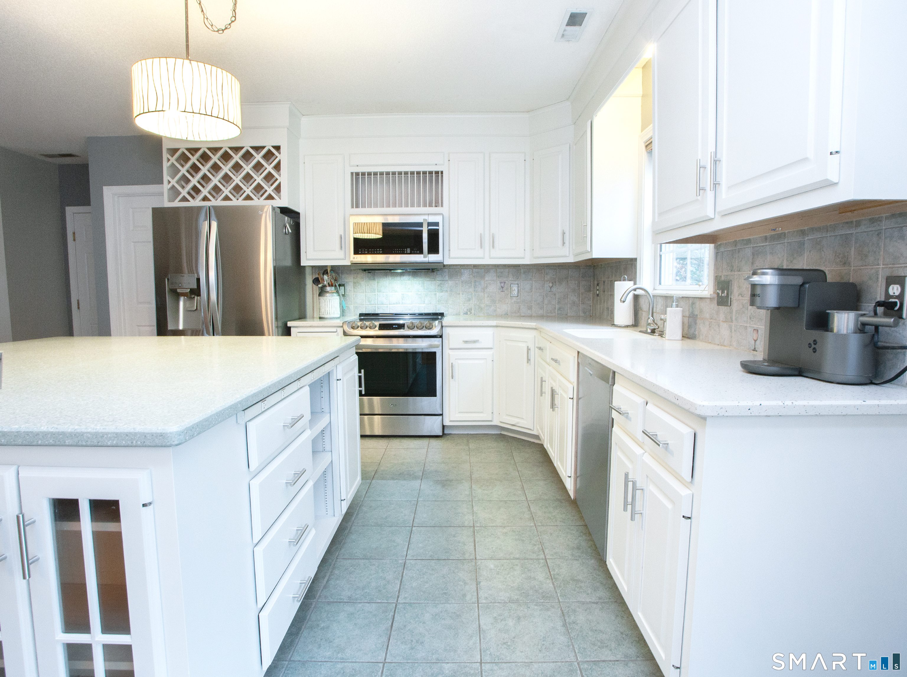 15 Rockledge Lane Canton, CT 06019 - Photo 6 of 30 a kitchen with stainless steel appliances a stove refrigerator sink and microwave