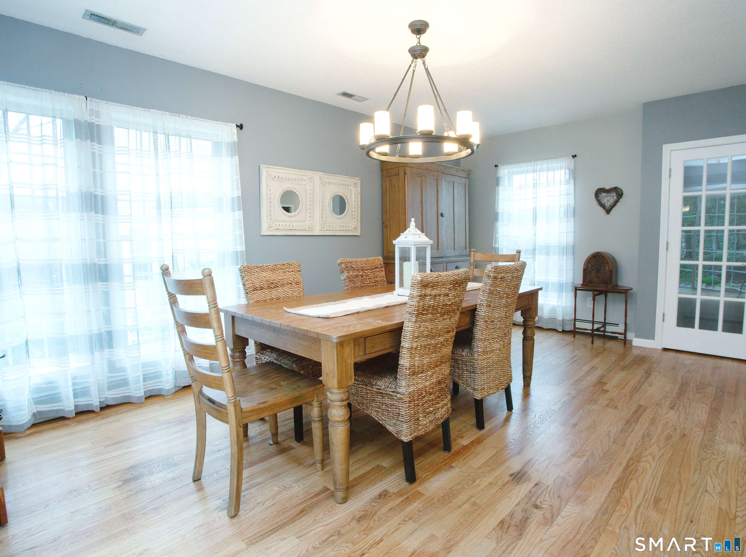 15 Rockledge Lane Canton, CT 06019 - Photo 8 of 30 a view of a dining room with furniture a chandelier and wooden floor