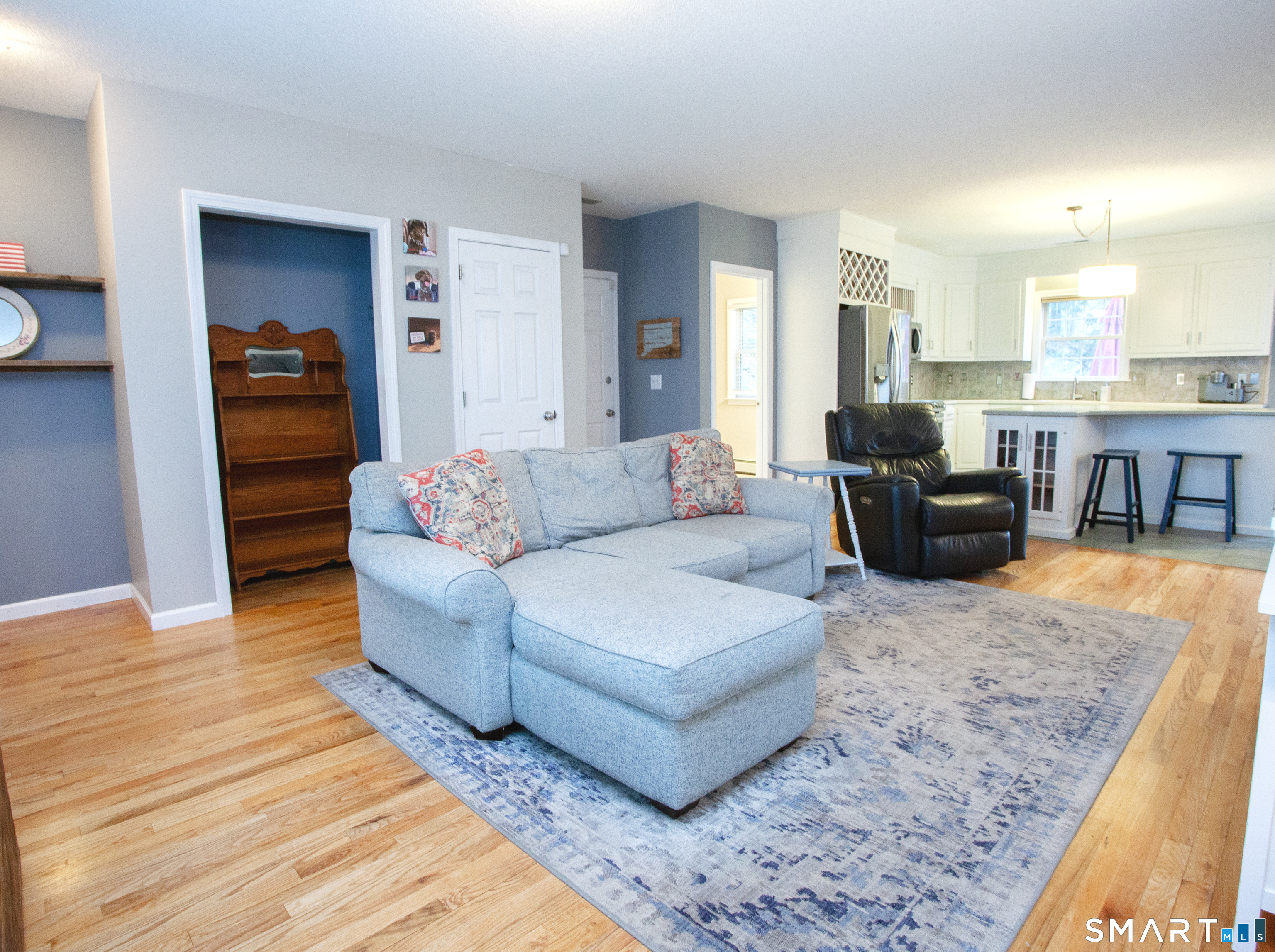 15 Rockledge Lane Canton, CT 06019 - Photo 9 of 30 a living room with furniture and a wooden floor