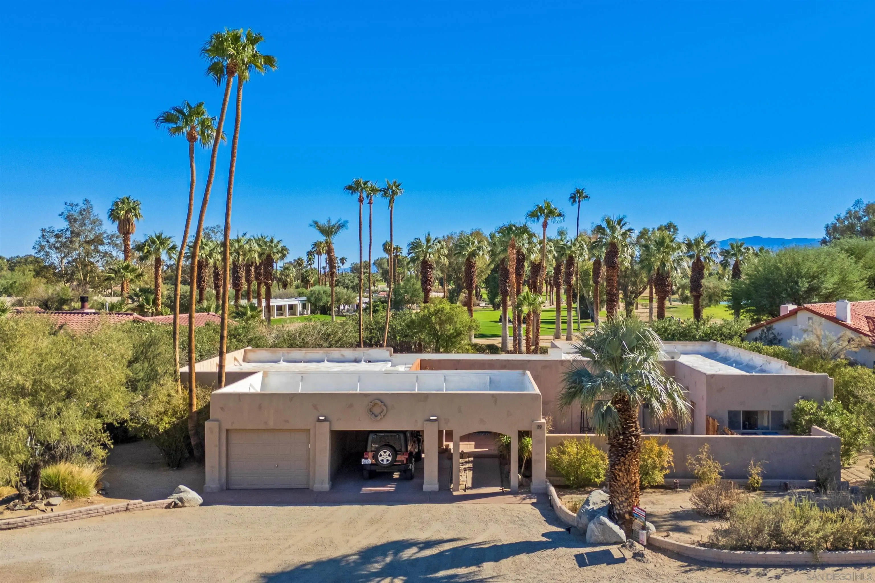 119 Montezuma Road Borrego Springs, CA 92004 - Photo 1 of 47 a view of a patio with swimming pool and a fountain