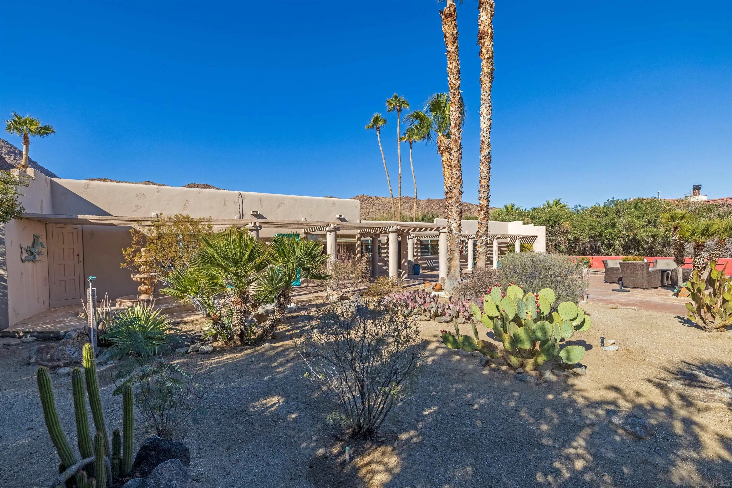 119 Montezuma Road Borrego Springs, CA 92004 - Photo 12 of 47 a view of a house with a yard and sitting area