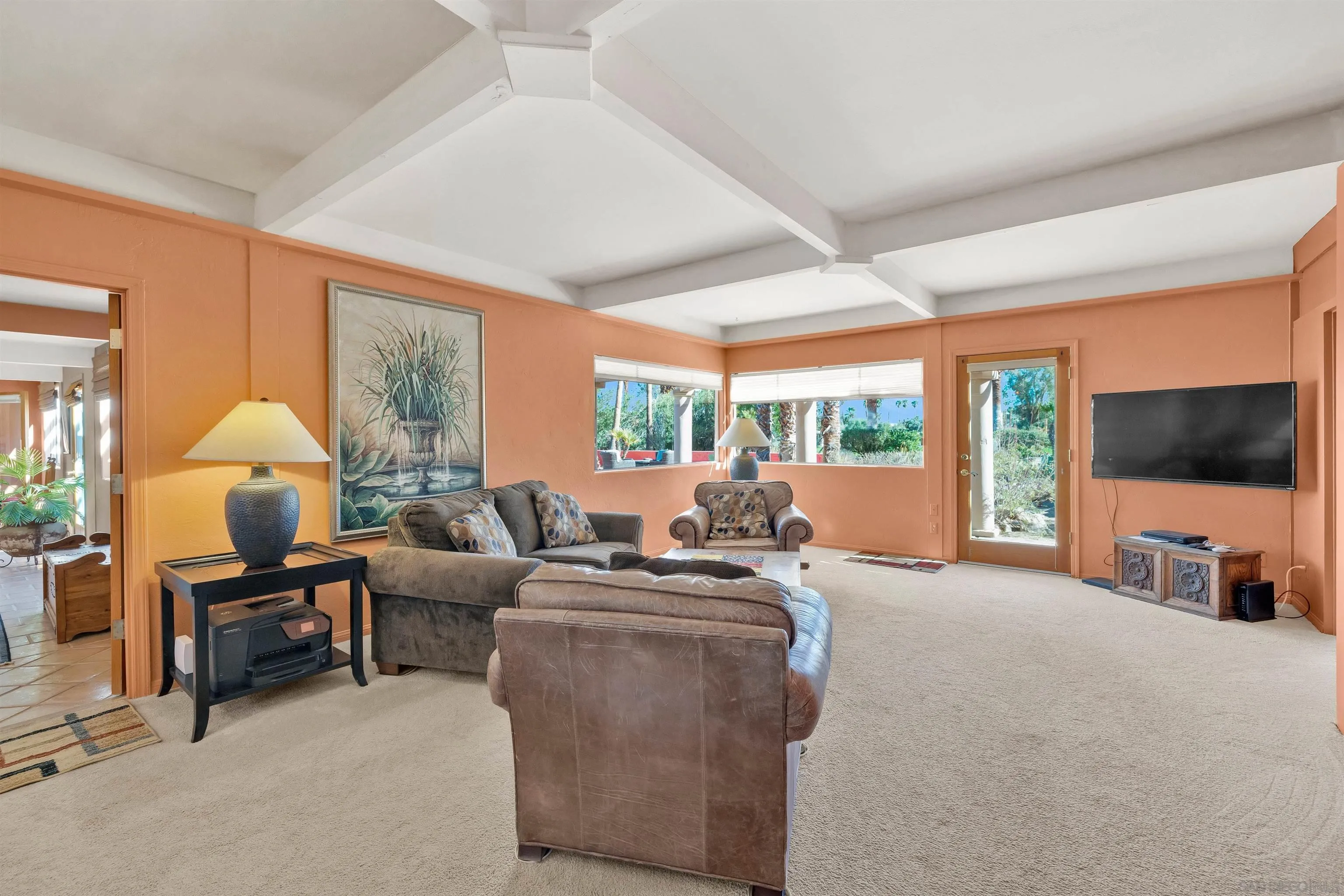 119 Montezuma Road Borrego Springs, CA 92004 - Photo 33 of 47 a living room with furniture a flat screen tv and a large window