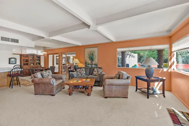 a view of a patio with a table chairs and a table