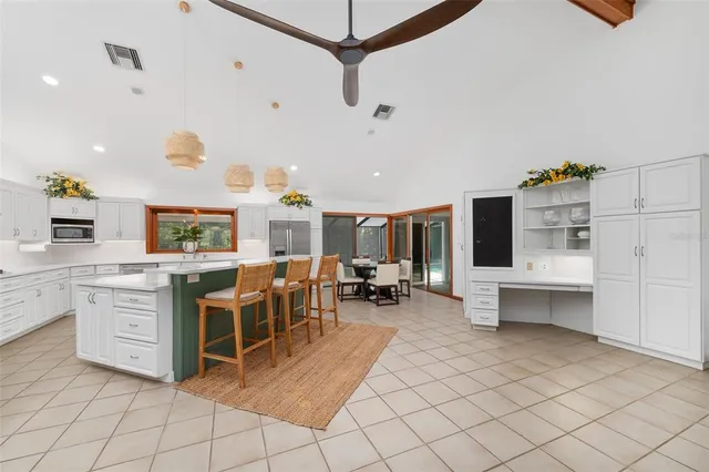 a kitchen with a sink a stove and cabinets