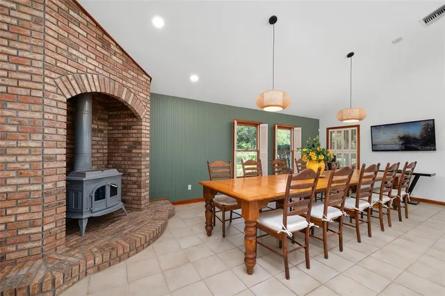 a bathroom with a granite countertop sink and a large mirror