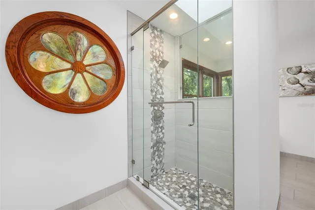 a bathroom with a shower and a sink