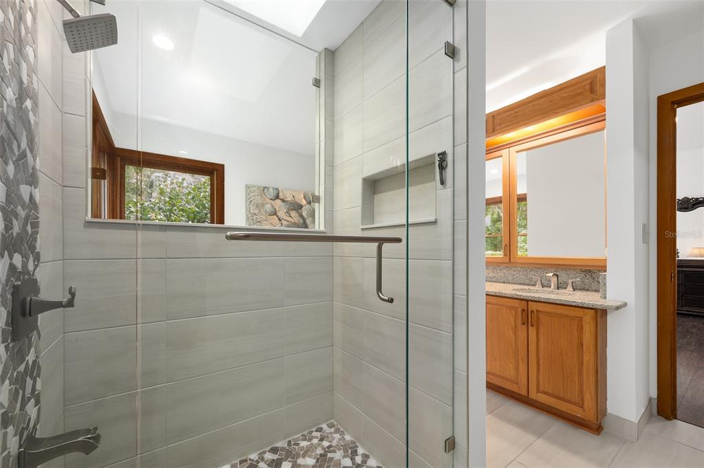 413 Southwest 97 Terrace Gainesville, FL 32607 - Photo 29 of 67 a bathroom with a shower and a sink