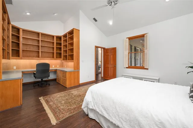 a view of an empty room with glass door and a window
