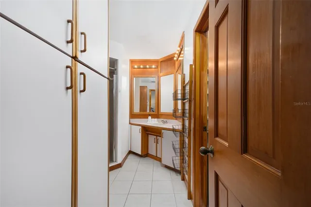 a bathroom with a sink and cabinets