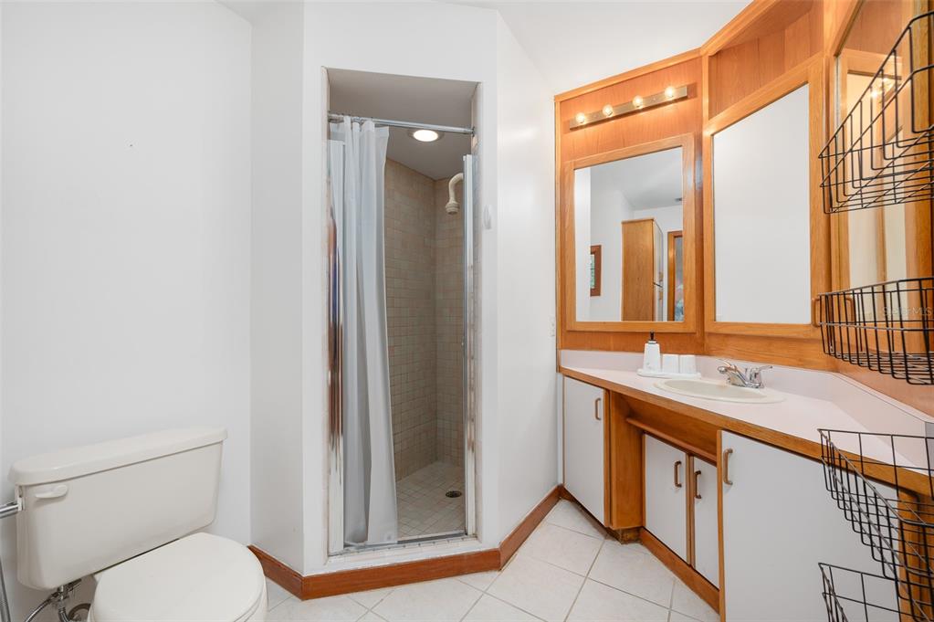 413 Southwest 97 Terrace Gainesville, FL 32607 - Photo 40 of 67 a bathroom with a granite countertop sink toilet and shower