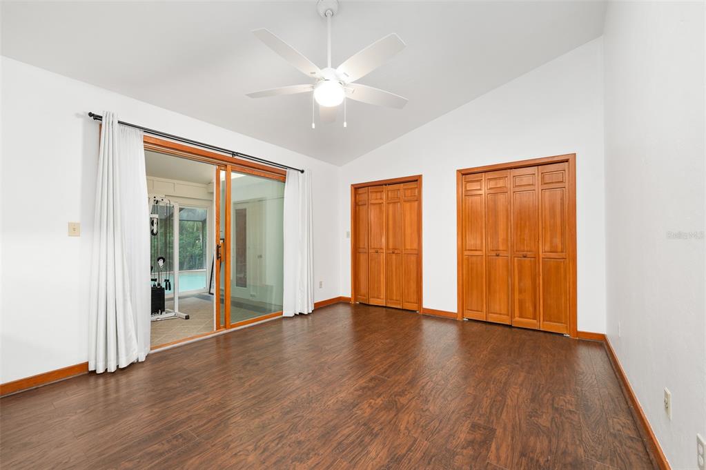413 Southwest 97 Terrace Gainesville, FL 32607 - Photo 43 of 67 a view of an empty room with wooden floor and a window