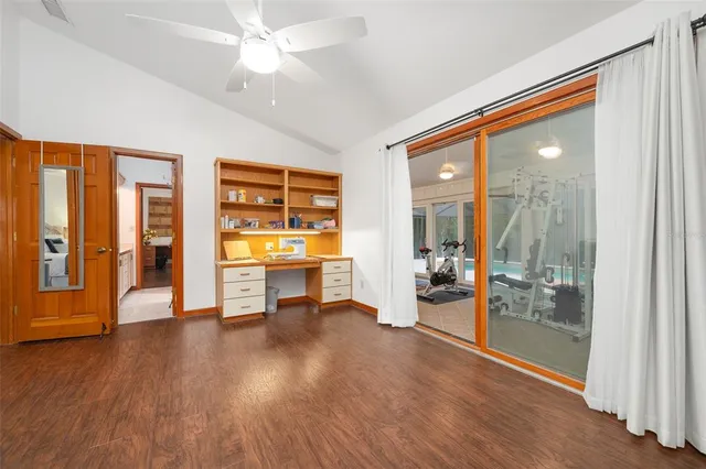 a dining room with furniture and wooden floor