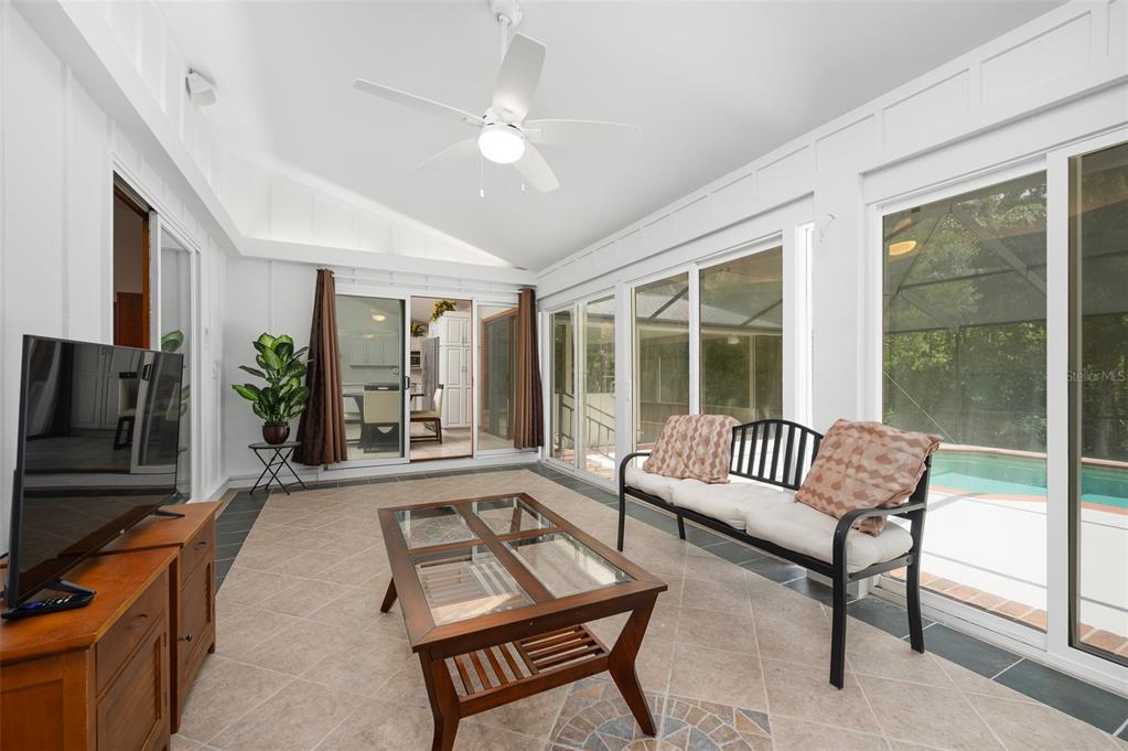 413 Southwest 97 Terrace Gainesville, FL 32607 - Photo 49 of 67 a living room with furniture and a flat screen tv