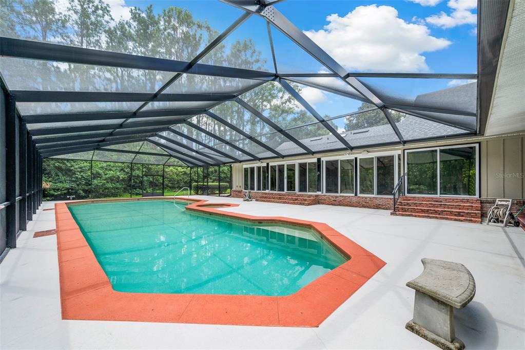 413 Southwest 97 Terrace Gainesville, FL 32607 - Photo 54 of 67 a view of a swimming pool with a patio
