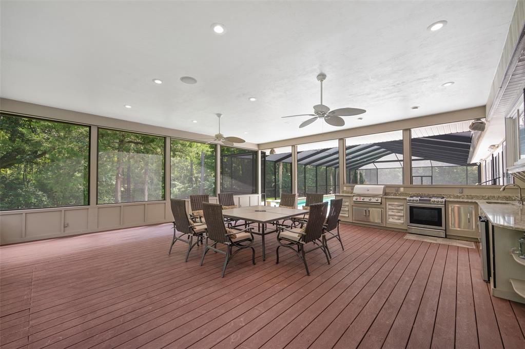 413 Southwest 97 Terrace Gainesville, FL 32607 - Photo 60 of 67 a dining room with furniture wooden floor clock and a chandelier