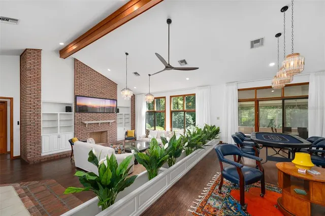 a view of a kitchen with a sink and wooden floor