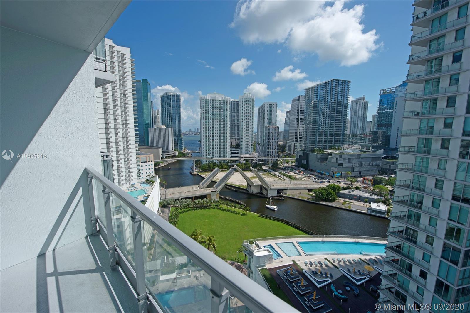 90 Southwest 3rd Street, Unit 2411 Miami, FL 33130 - Photo 2 of 22 a view of a balcony with chairs