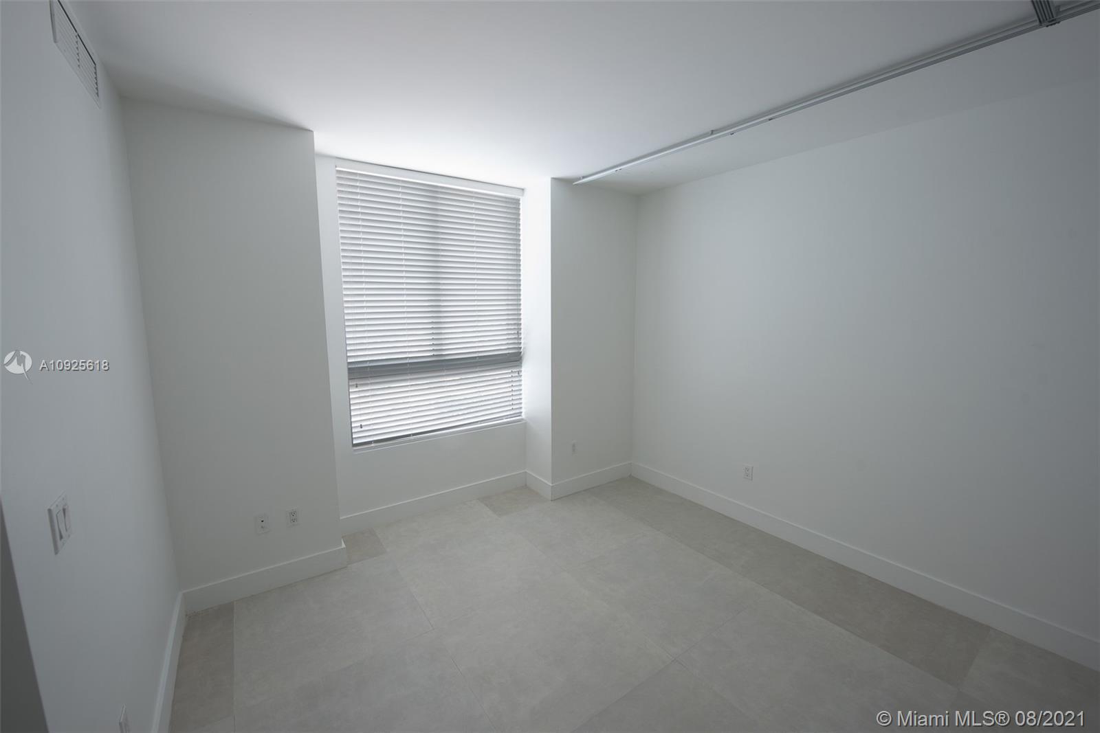 90 Southwest 3rd Street, Unit 2411 Miami, FL 33130 - Photo 17 of 22 a view of an empty room with a window