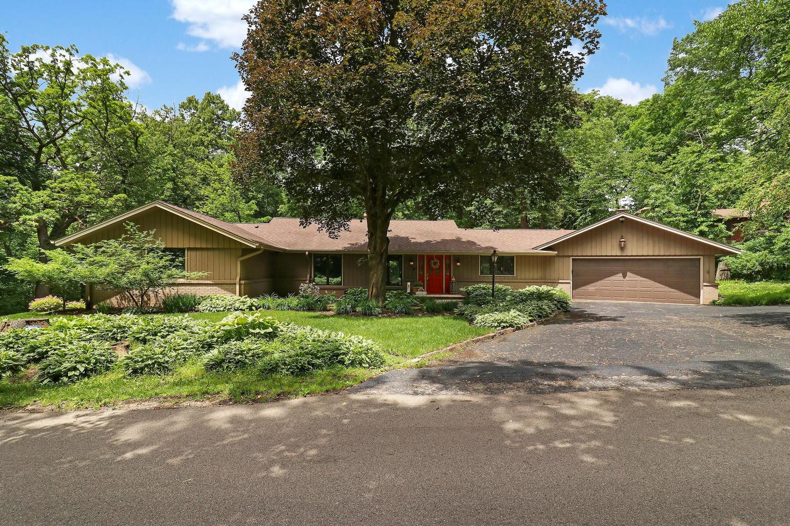 112 River Drive Trout Valley, IL 60013 - Photo 1 of 28 a front view of a house with a yard and garage