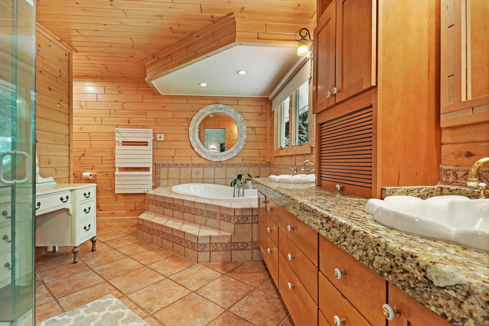 112 River Drive Trout Valley, IL 60013 - Photo 14 of 28 a bathroom with a granite countertop sink and a large mirror