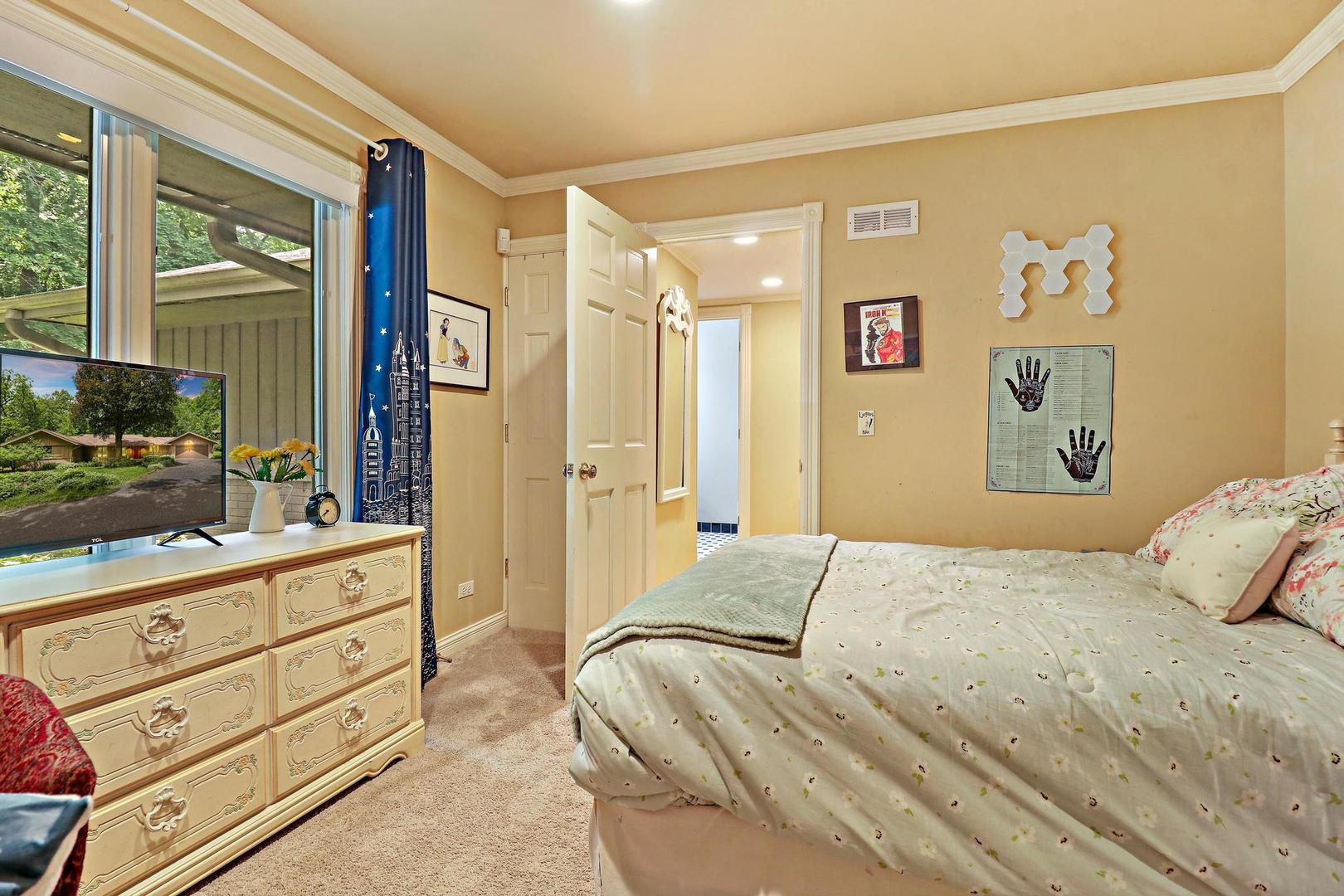 112 River Drive Trout Valley, IL 60013 - Photo 18 of 28 a spacious bedroom with a bed and a mirror