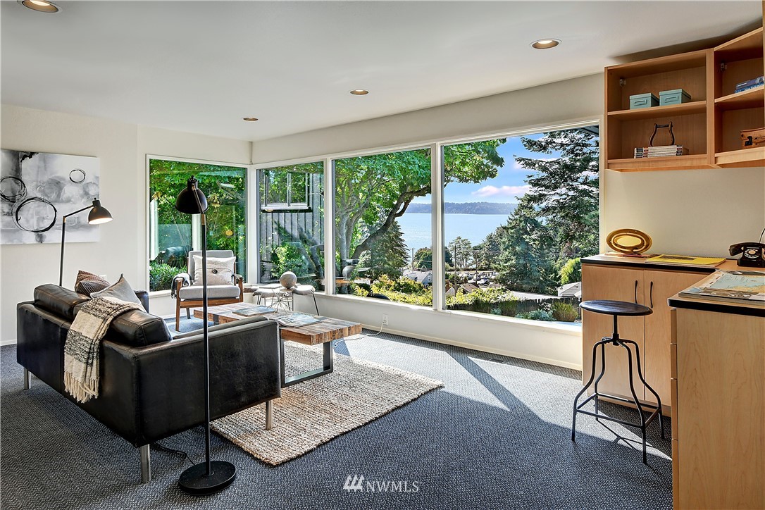 8425 Tillicum Road Southwest Seattle, WA 98136 - Photo 14 of 25 a living room with furniture and a floor to ceiling window