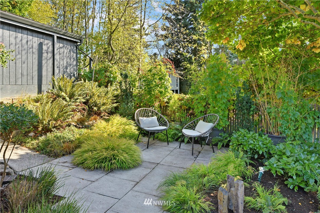 8425 Tillicum Road Southwest Seattle, WA 98136 - Photo 9 of 25 a view of a backyard with plants and chairs