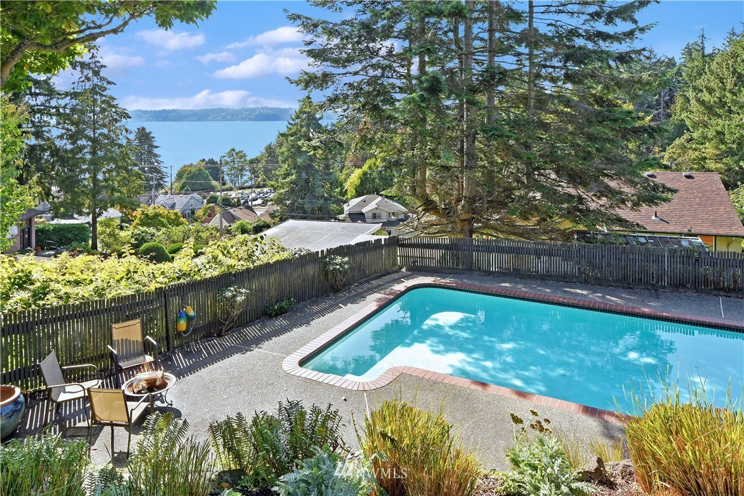 8425 Tillicum Road Southwest Seattle, WA 98136 - Photo 10 of 25 a view of a swimming pool with a yard