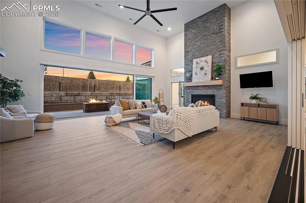 13525 Random Ridge View Colorado Springs, CO 80921 - Photo 8 of 43 A fully insulated indoor-outdoor living space designed for year-round comfort, with heating and cooling for every season. Expansive sliders open completely to the outdoors or close to create a cozy indoor retreat, complete with a gas fireplace and infrared grill for all-season enjoyment.