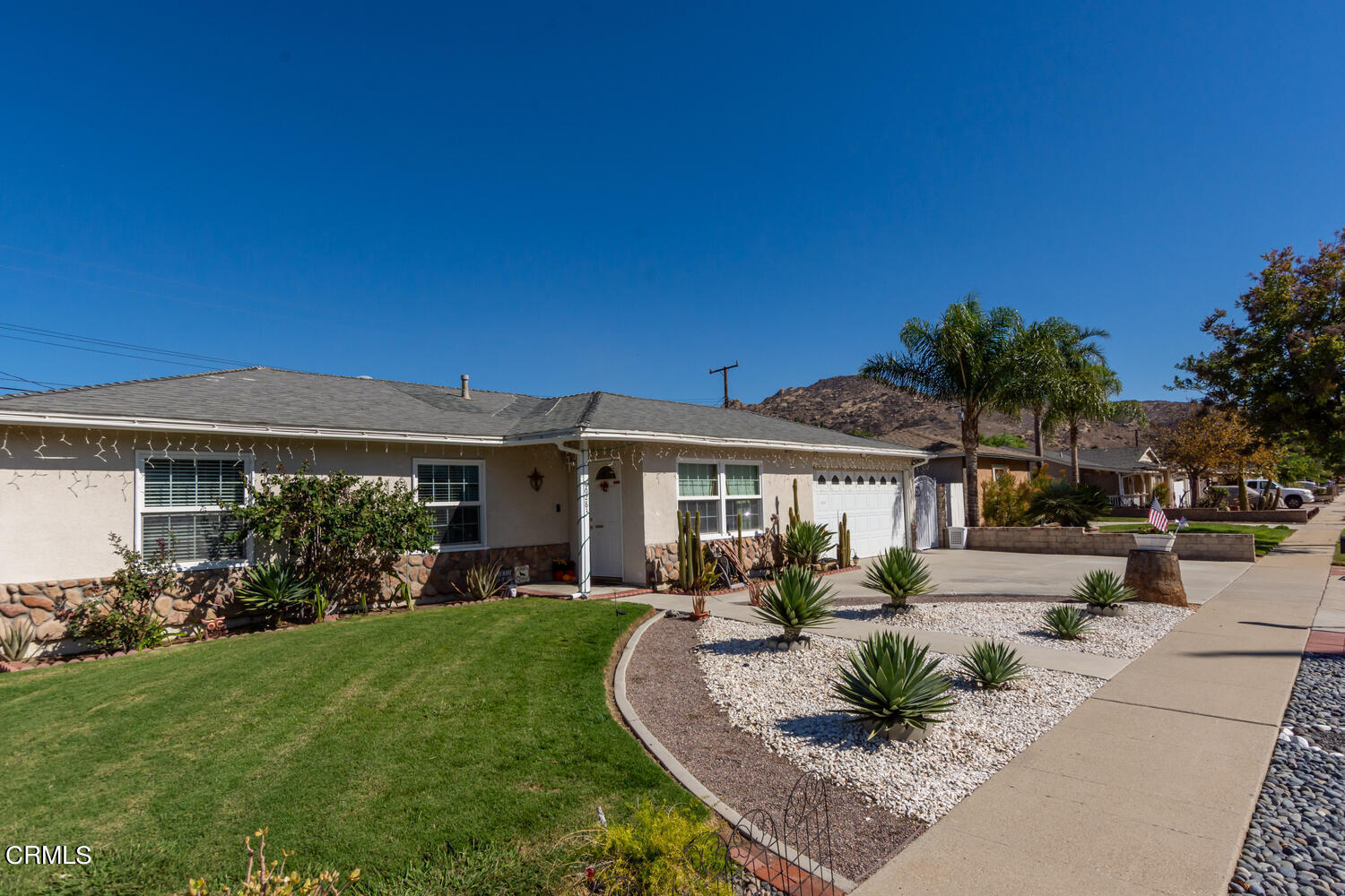 6283 Marsha Avenue Simi Valley, CA 93063 - Photo 2 of 21 a front view of a house with garden