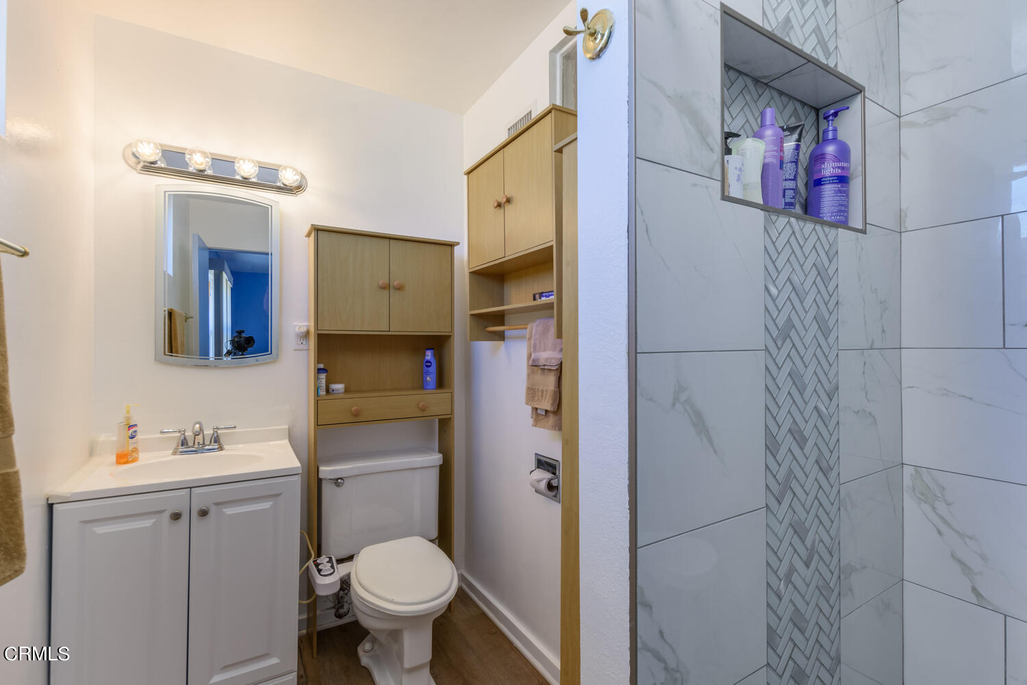 6283 Marsha Avenue Simi Valley, CA 93063 - Photo 11 of 21 a bathroom with a toilet sink and mirror