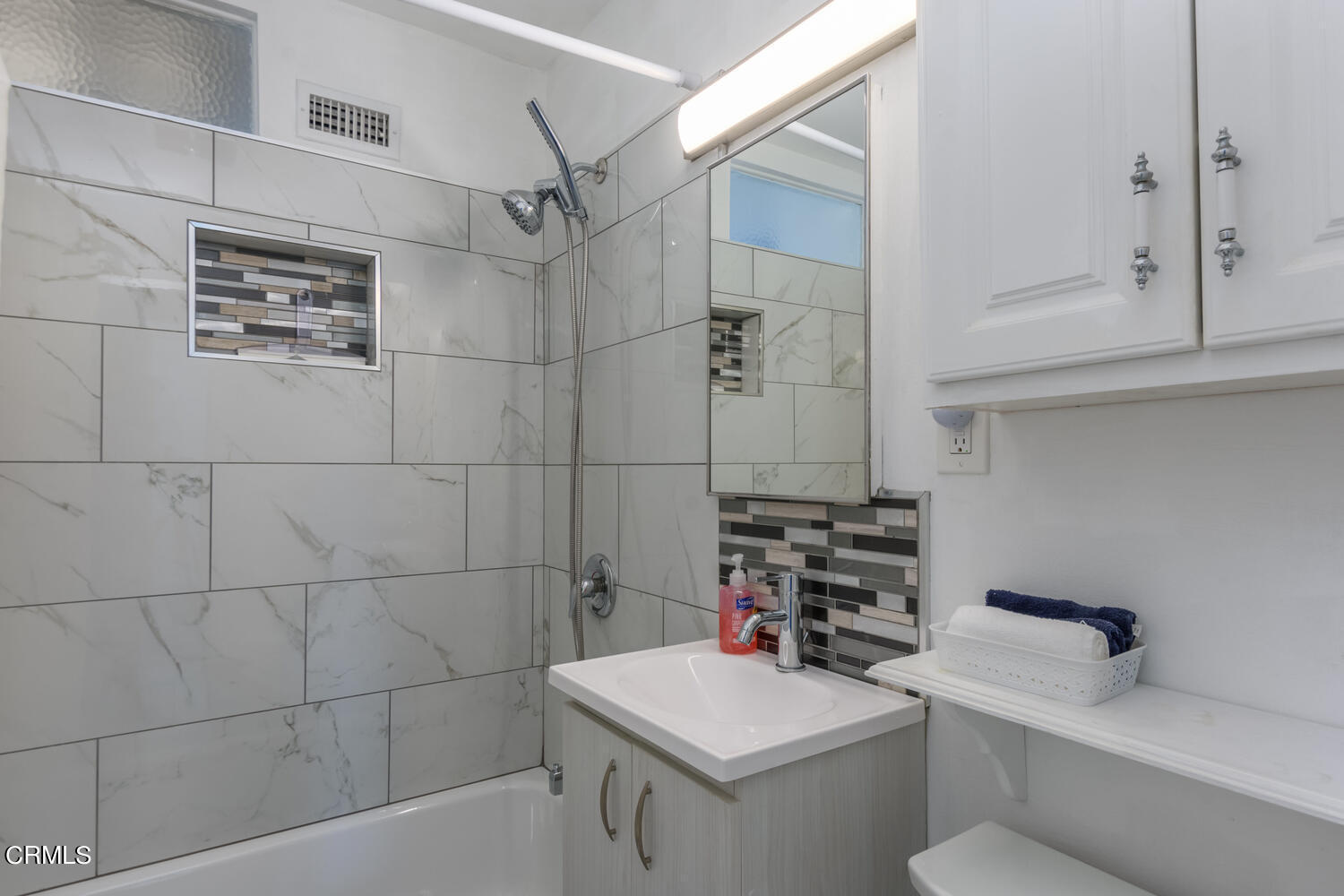 6283 Marsha Avenue Simi Valley, CA 93063 - Photo 12 of 21 a bathroom with a sink toilet and shower