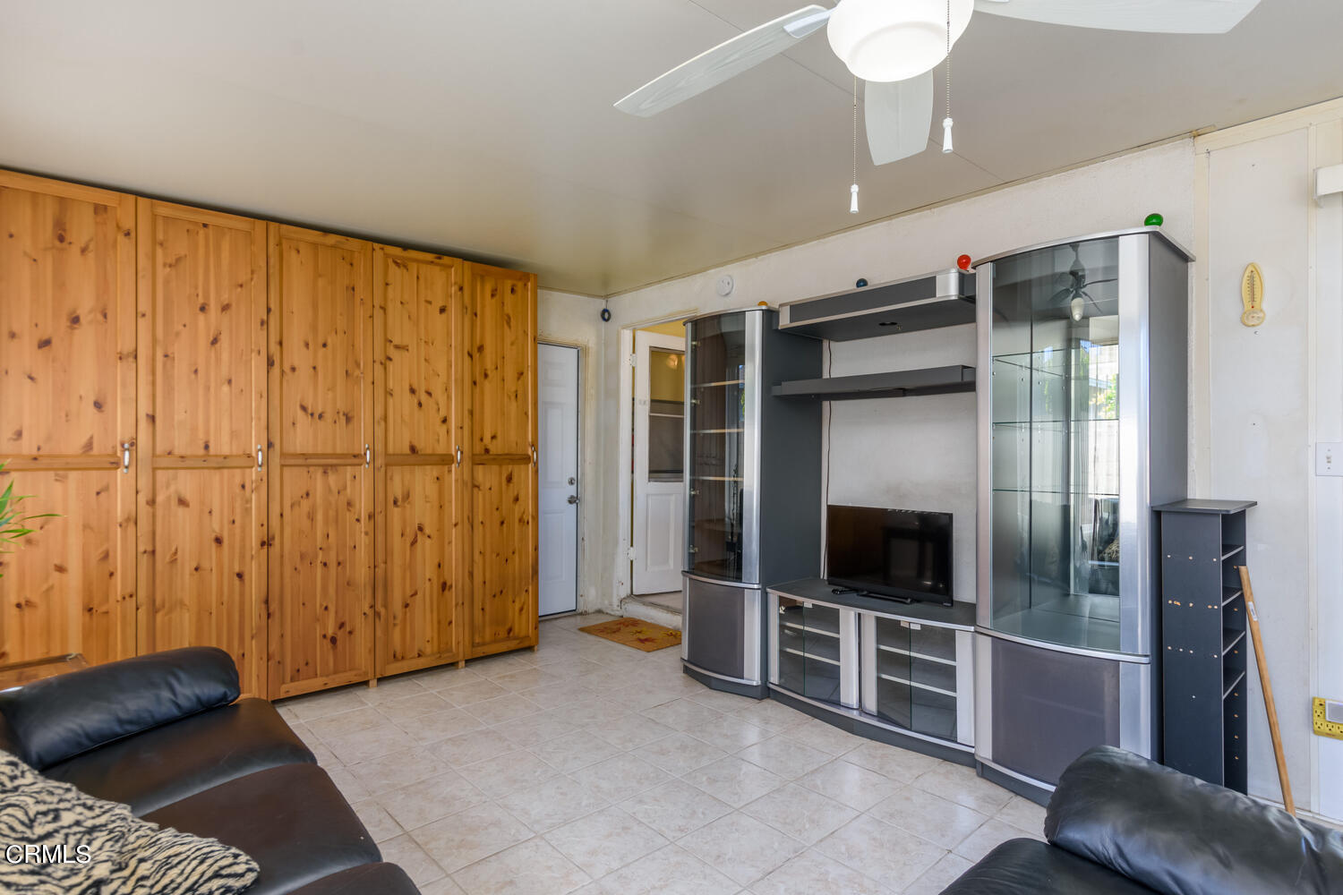 6283 Marsha Avenue Simi Valley, CA 93063 - Photo 16 of 21 a living room with furniture and a flat screen tv