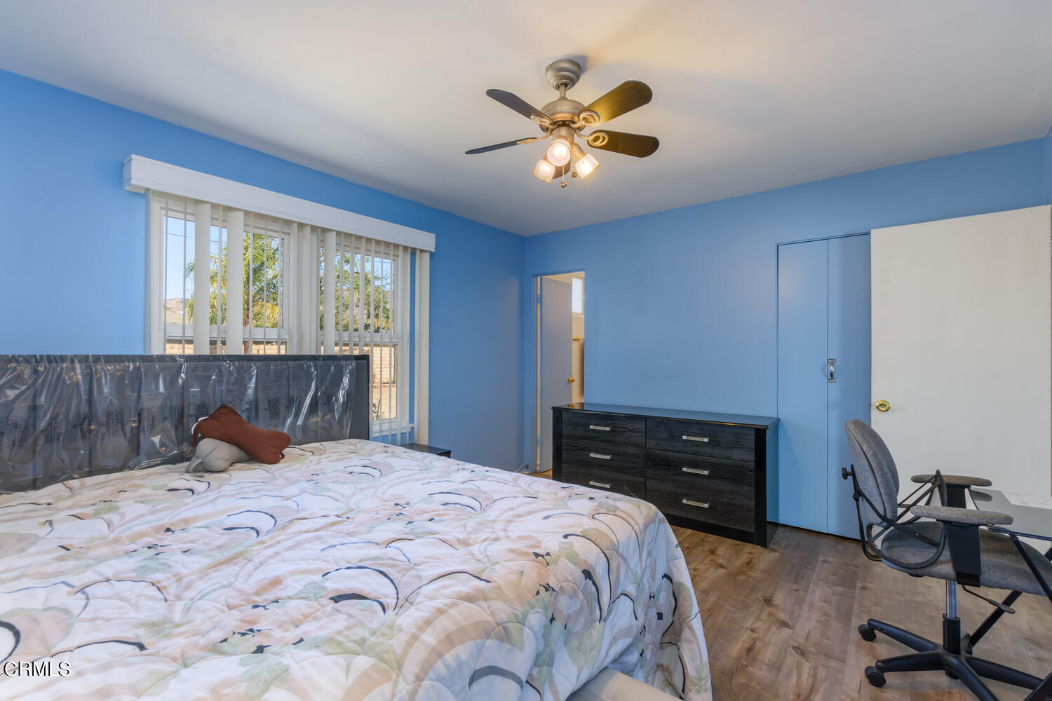 6283 Marsha Avenue Simi Valley, CA 93063 - Photo 9 of 21 a bedroom with a bed and a chandelier