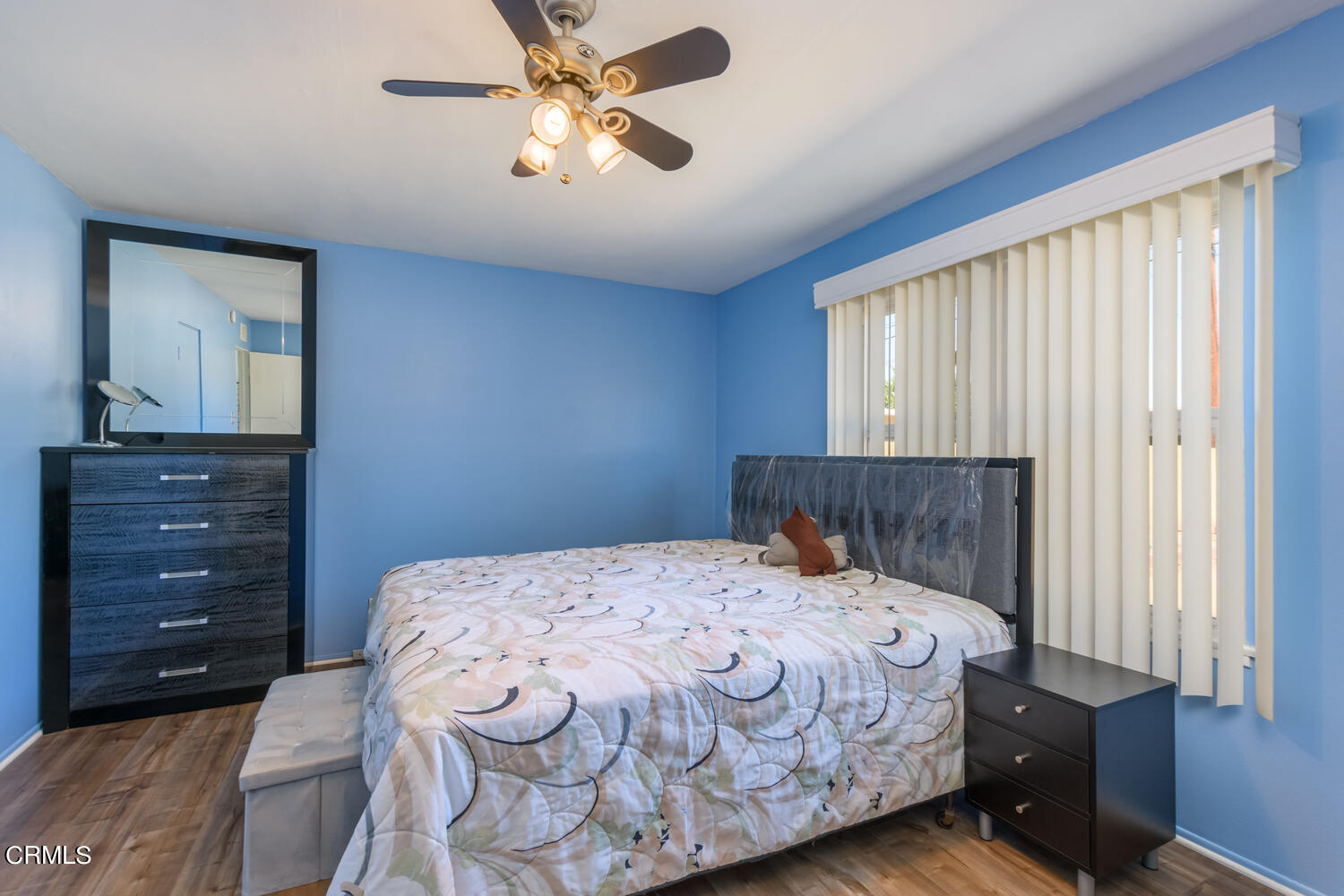 6283 Marsha Avenue Simi Valley, CA 93063 - Photo 10 of 21 a bedroom with a bed a dresser and a window