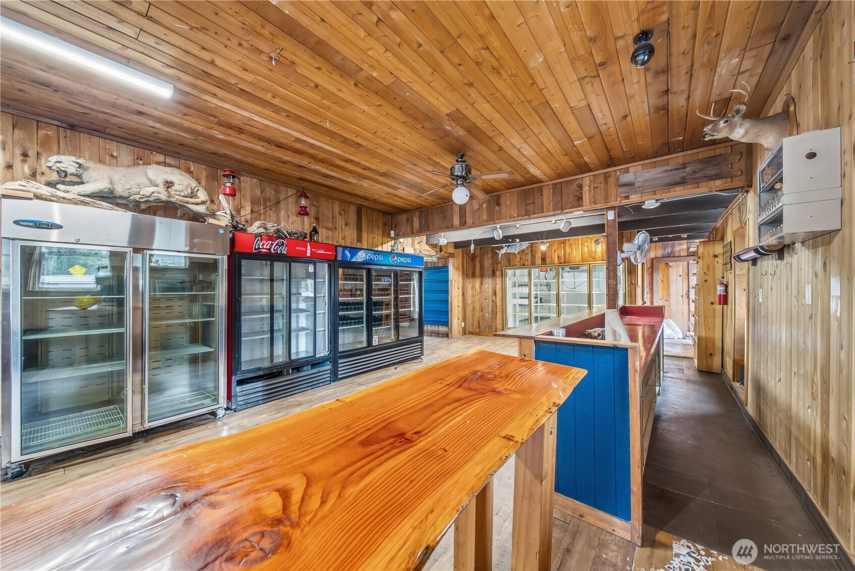 810 South Lake Roesiger Road Snohomish, WA 98290 - Photo 11 of 21 a view of a storage room with wooden floor
