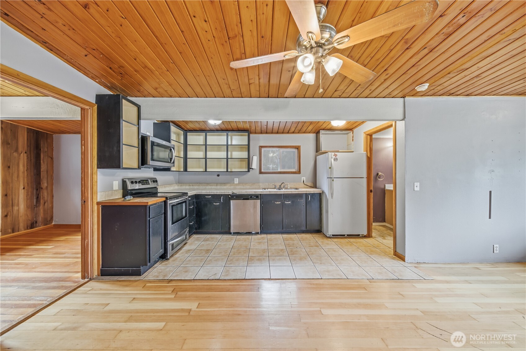 810 South Lake Roesiger Road Snohomish, WA 98290 - Photo 18 of 21 a large kitchen with stainless steel appliances kitchen island granite countertop a sink and cabinets