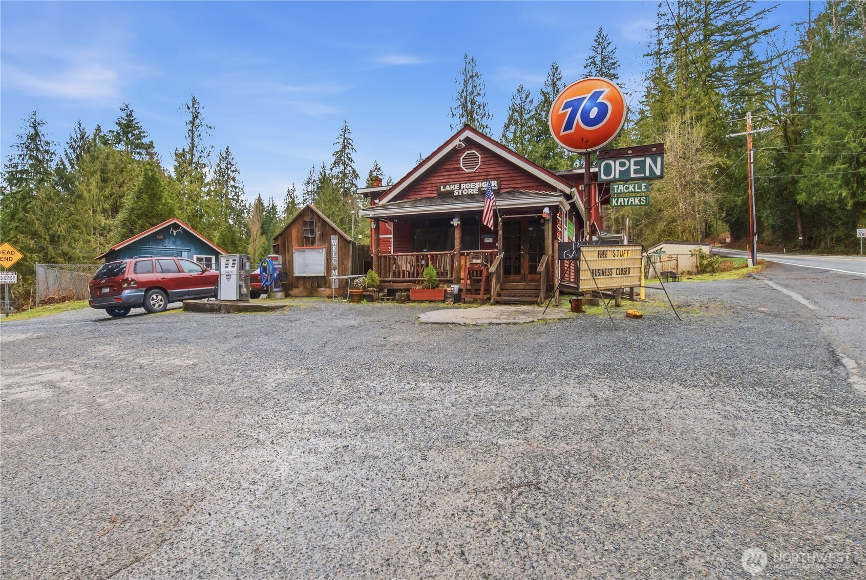 810 South Lake Roesiger Road Snohomish, WA 98290 - Photo 4 of 21 a view of an house with sign board and a yard