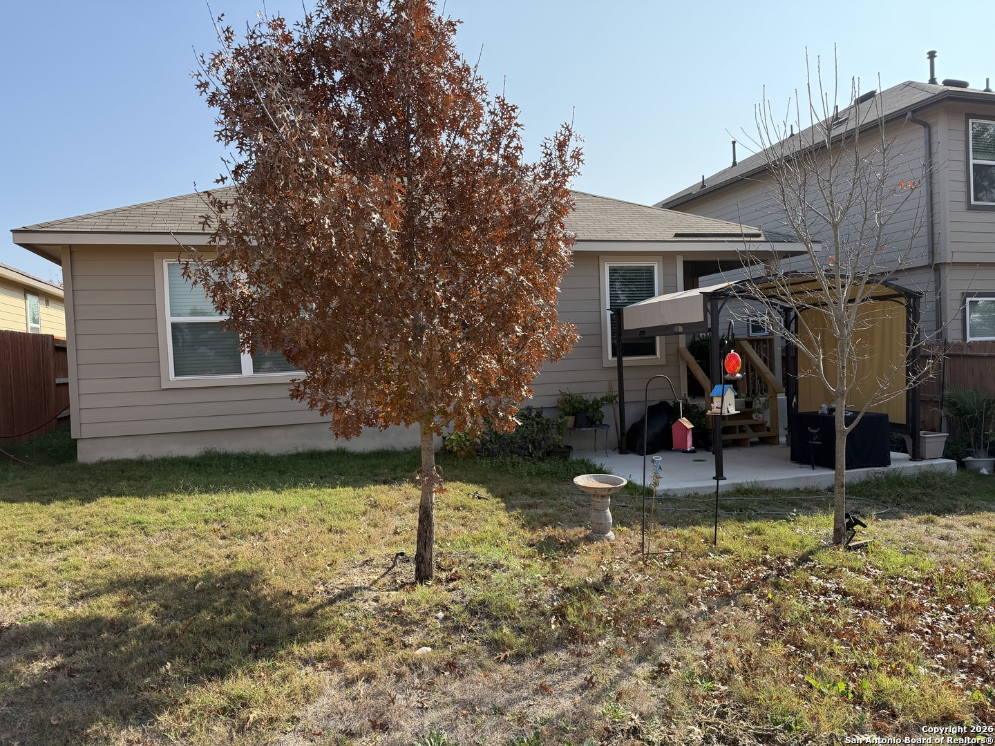 29413 Sierra Copper Bulverde, TX 78163 - Photo 6 of 6 a view of a backyard with a tree beside of it