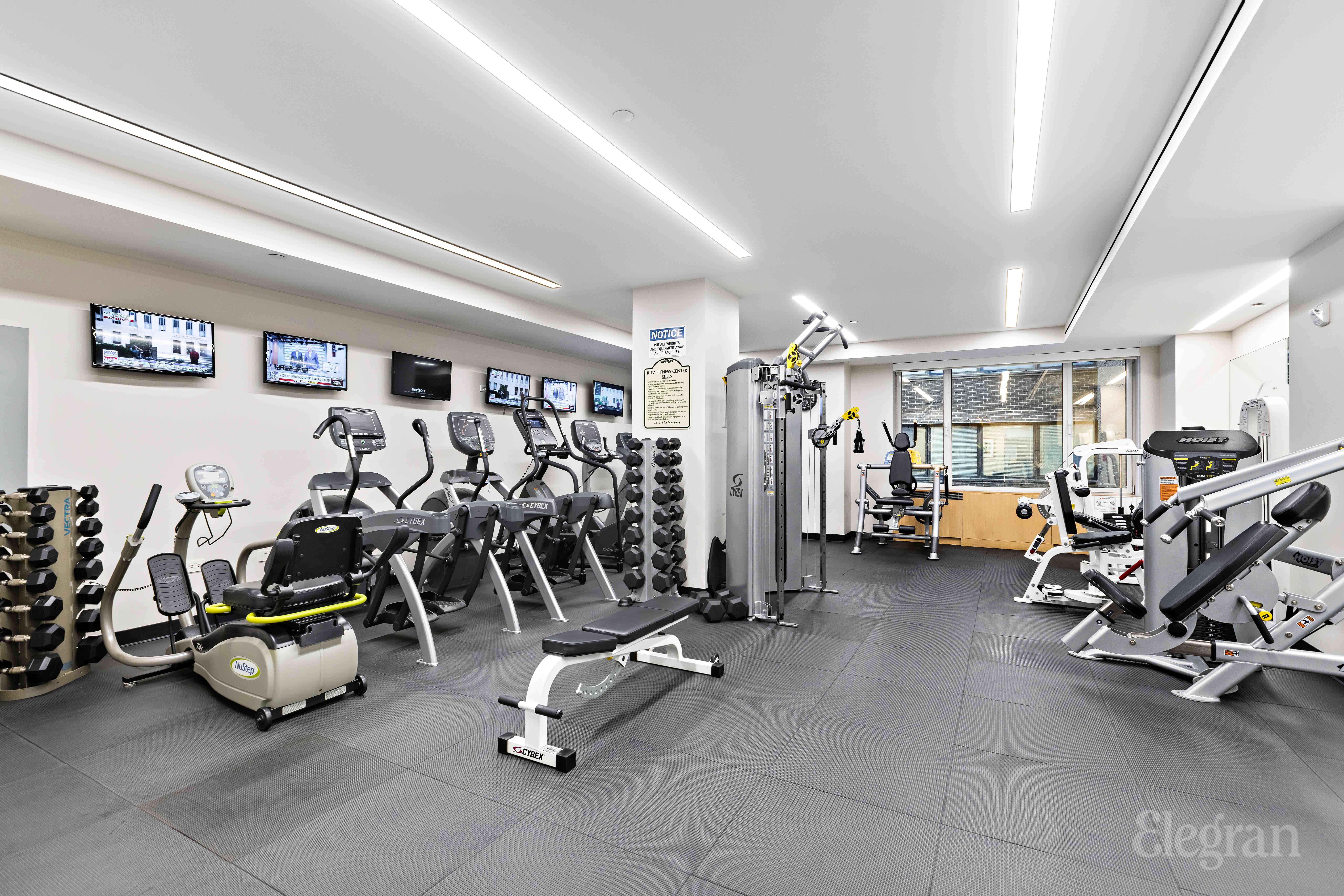 465 Park Avenue, Unit 18E Manhattan, NY 10022 - Photo 12 of 15 a view of a room with gym equipment