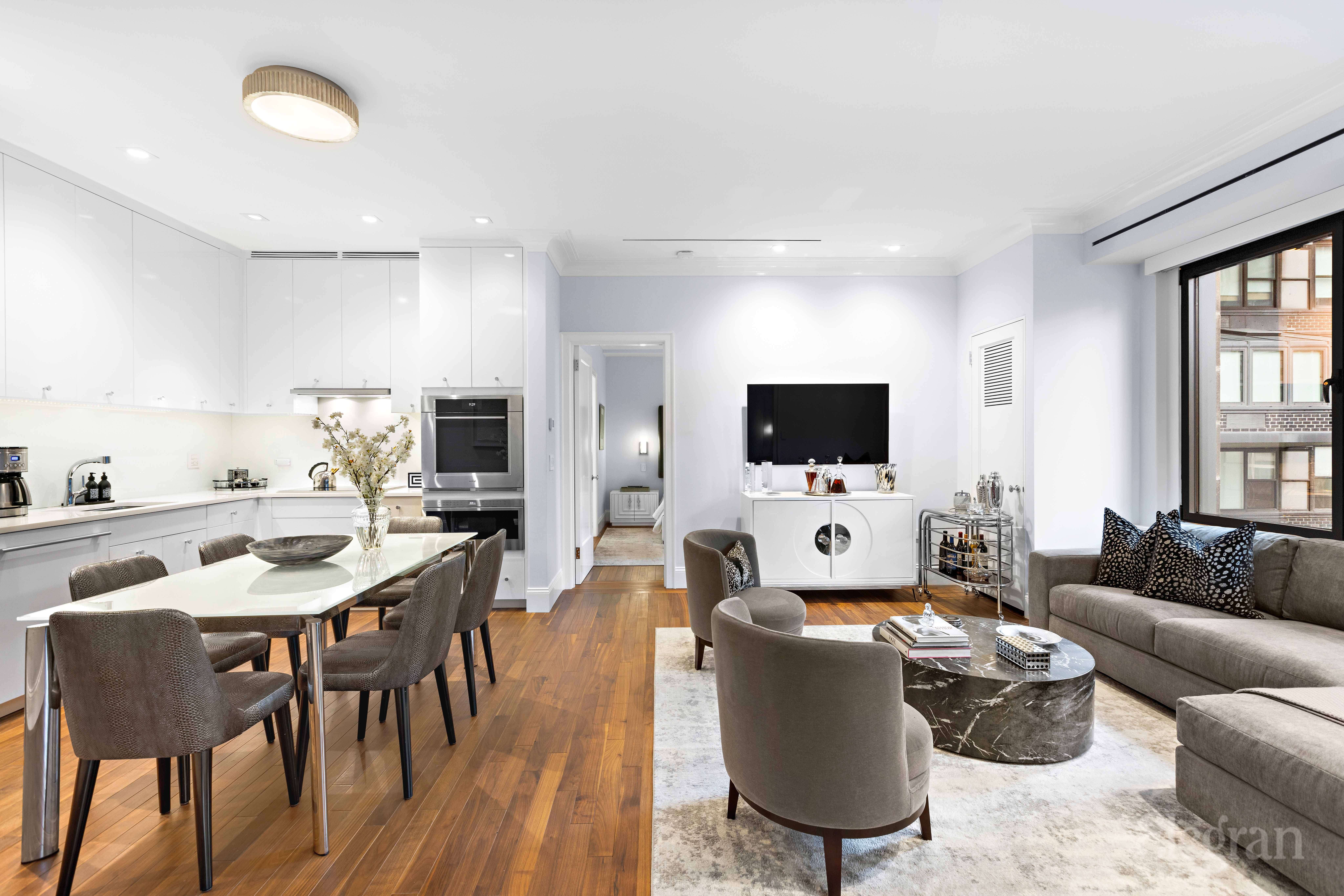465 Park Avenue, Unit 18E Manhattan, NY 10022 - Photo 5 of 15 a living room with furniture and a flat screen tv