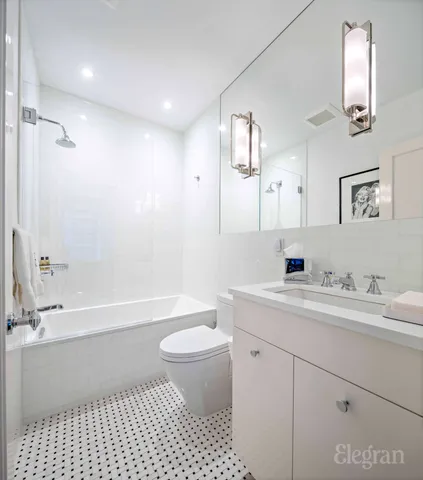 a view of a room with wooden floor window and a mirror