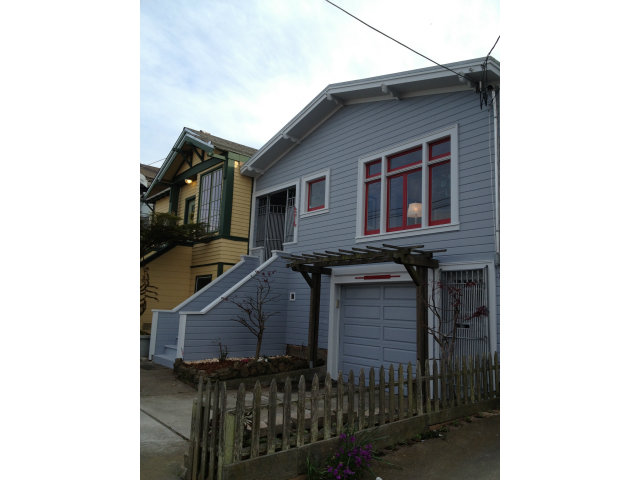 a front view of a house with glass windows