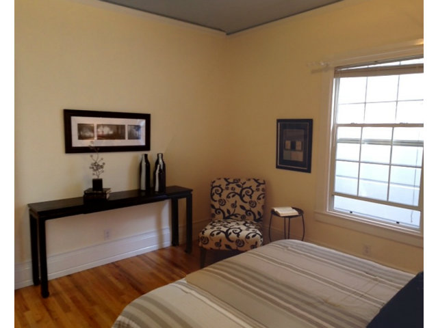 374 Rolph Street San Francisco, CA 94112 - Photo 13 of 20 a bedroom with a bed and a window