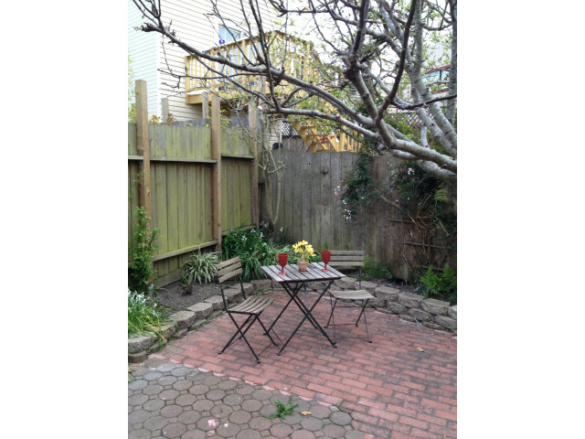 374 Rolph Street San Francisco, CA 94112 - Photo 18 of 20 a backyard of a house with table and chairs