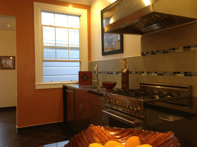 374 Rolph Street San Francisco, CA 94112 - Photo 20 of 20 a kitchen with a stove and a cabinet