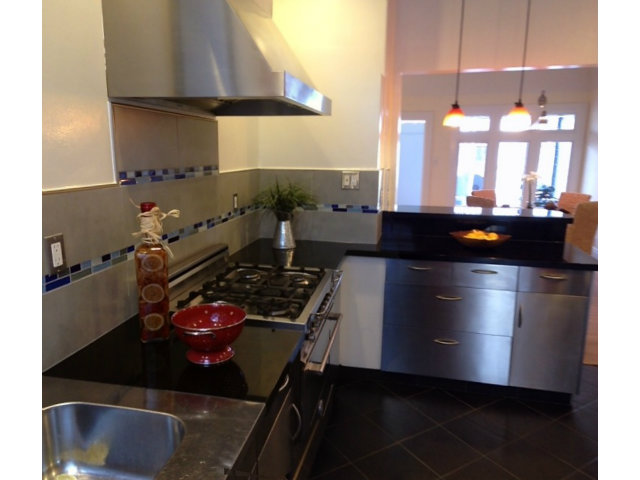 374 Rolph Street San Francisco, CA 94112 - Photo 10 of 20 a kitchen with a stove and a refrigerator