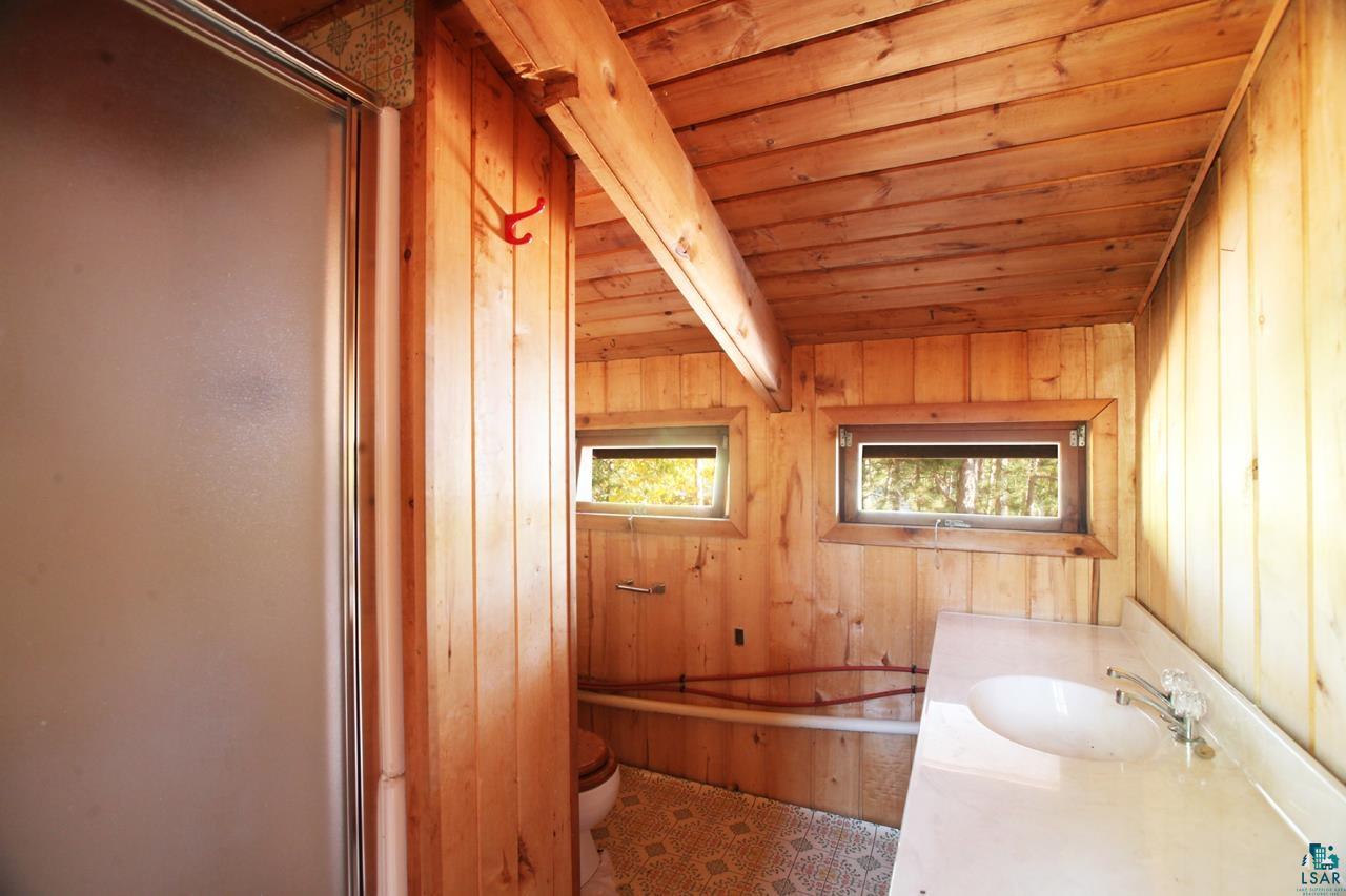 3-4 Wakemup Narrows North Cook, MN 55723 - Photo 8 of 41 Bathroom featuring wood ceiling, wooden walls, vanity, and toilet